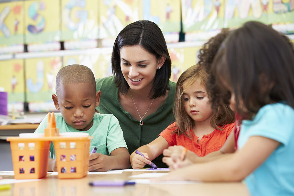 24488422 - group of elementary age children in art class with teacher