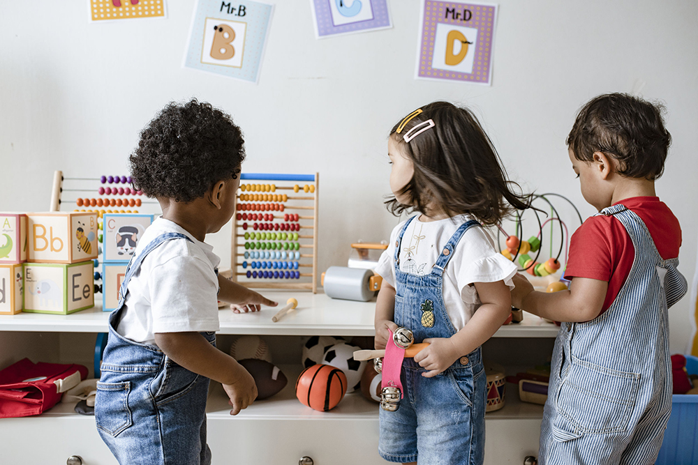 Young children playing with educational toys