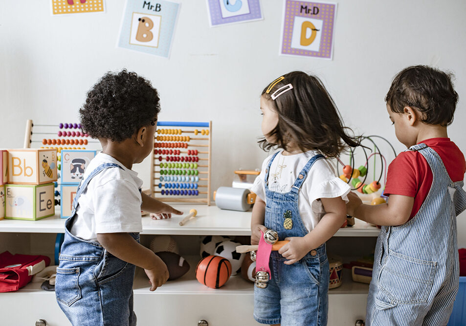 Young children playing with educational toys